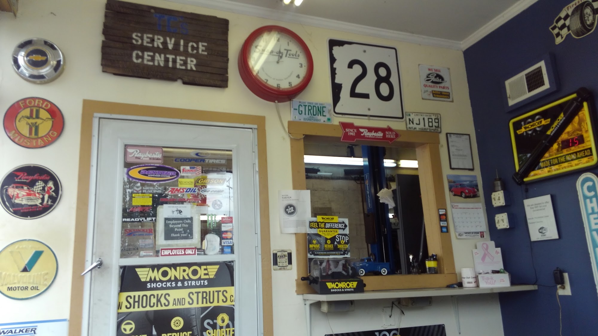TC’s service counter with automotive memorabilia and the TC’s Service Centre wall sign